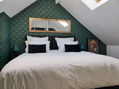 Un ou plusieurs lits dans un hébergement de l'établissement Love Room Lili Bulle