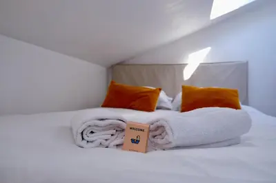 Un ou plusieurs lits dans un hébergement de l'établissement Duplex atypique et cosy au cœur de Rouen