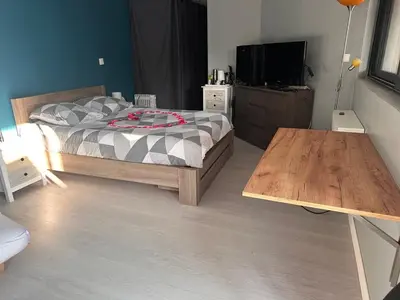 Un ou plusieurs lits dans un hébergement de l'établissement Chambre pour 4 personnes avec SdB privative et jacuzzi
