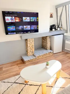 Télévision ou salle de divertissement dans l'établissement Literie d'exception, luxe calme et confort