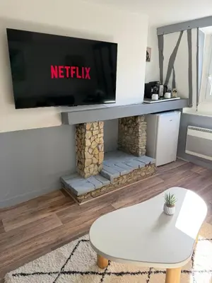 Télévision ou salle de divertissement dans l'établissement Literie d'exception, luxe calme et confort