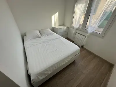 Un ou plusieurs lits dans un hébergement de l'établissement Charmant appartement - 6 couchages