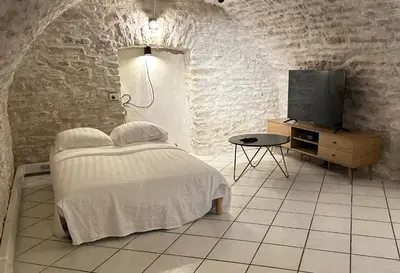 Un ou plusieurs lits dans un hébergement de l'établissement Charmant appartement - 6 couchages