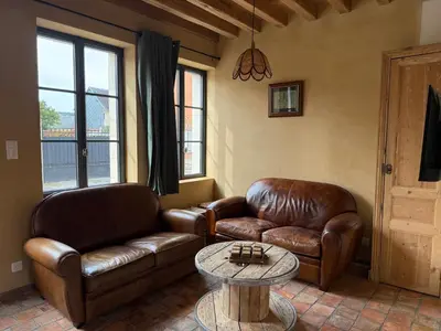 Coin salon dans l'établissement Le Gîte du Bonheur - Maison normande familiale