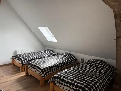 Un ou plusieurs lits dans un hébergement de l'établissement Le Gîte du Bonheur - Maison normande familiale
