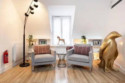 Coin salon dans l'établissement Suite Appart Place Versepuy