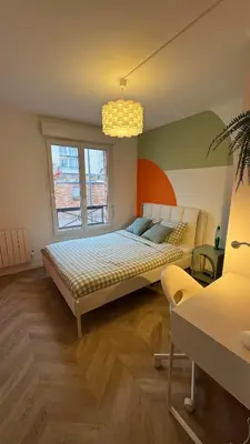 Un ou plusieurs lits dans un hébergement de l'établissement La Rétro-Capsule - 2 chambres & parking