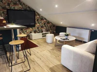 Télévision ou salle de divertissement dans l'établissement Loft envie deux