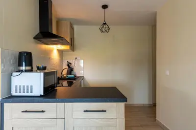 Cuisine ou kitchenette dans l'établissement Le Reflet de l'Horizon - Proche Plage