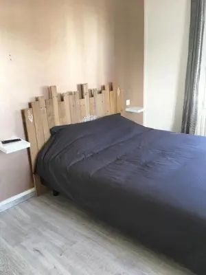 Un ou plusieurs lits dans un hébergement de l'établissement Maison individuelle avec Jardinet