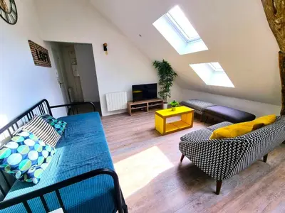 Coin salon dans l'établissement L'appartement tranquillité