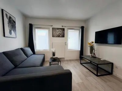 Télévision ou salle de divertissement dans l'établissement Grand Studio Lumineux Proche Centre-Ville