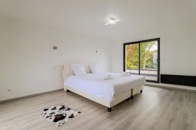 Un ou plusieurs lits dans un hébergement de l'établissement La Maison Bellevue - Garden Parking 13 min from Amiens