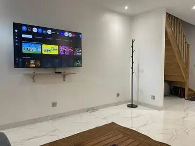 Télévision ou salle de divertissement dans l'établissement Pavillion Peuple de l'Herbe