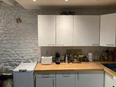 Cuisine ou kitchenette dans l'établissement Maison Cosy et Typique au Coeur de Maule