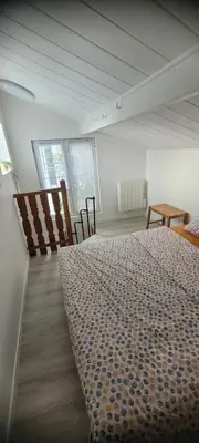Un ou plusieurs lits dans un hébergement de l'établissement Cocon cosy en plein centre ville proche Paris à 2 pas de la gare