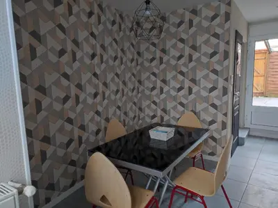Coin salon dans l'établissement Maison cosy pour famille - groupe proche toutes commodités