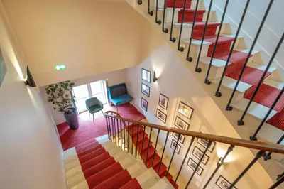 Télévision ou salle de divertissement dans l'établissement La Léontine