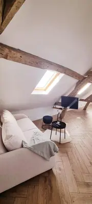Un ou plusieurs lits dans un hébergement de l'établissement Charmant appartement 2 pièces, 1 chambres