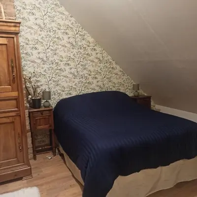 Un ou plusieurs lits dans un hébergement de l'établissement Le presbytère de Bueil - Gite 8 pers - 5 couchages