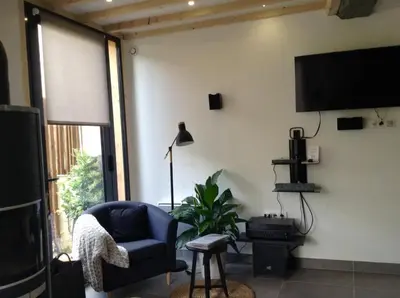 Télévision ou salle de divertissement dans l'établissement Les Co Gîte