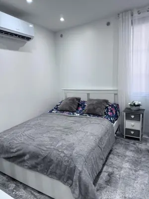 Un ou plusieurs lits dans un hébergement de l'établissement Studio le Plessis