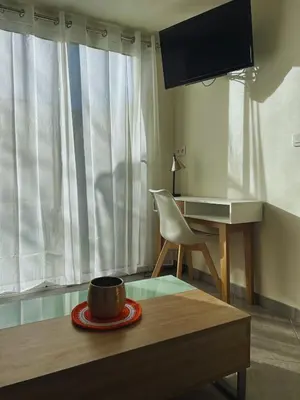 Télévision ou salle de divertissement dans l'établissement Le cocon bleu, duplex cosy et lumineux