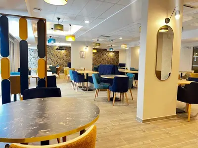 Restaurant ou autre lieu de restauration dans l'établissement Cosy Diem Franconville