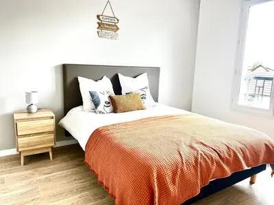 Un ou plusieurs lits dans un hébergement de l'établissement Cosy Diem Franconville