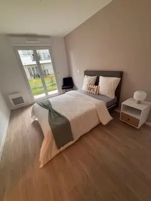 Un ou plusieurs lits dans un hébergement de l'établissement Cosy Diem Franconville