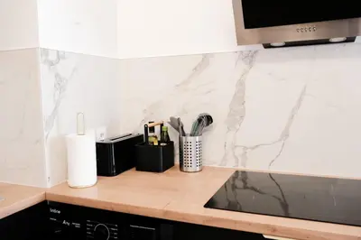Cuisine ou kitchenette dans l'établissement Rouen Gare centre Ménage et linge inclus