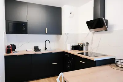 Cuisine ou kitchenette dans l'établissement Rouen Gare centre Ménage et linge inclus
