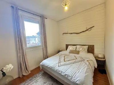 Un ou plusieurs lits dans un hébergement de l'établissement Maison avec jardin - 10 min de Rouen