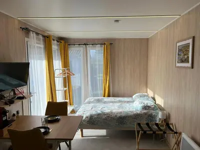 Un ou plusieurs lits dans un hébergement de l'établissement Chalet charmant à Acheux-en-Vimeu, 20 m², jardin