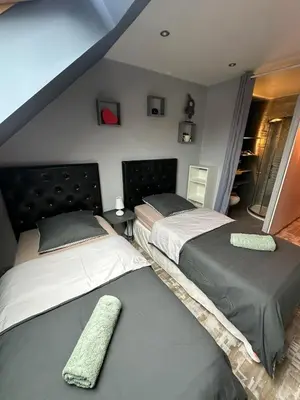 Un ou plusieurs lits dans un hébergement de l'établissement Sweet Home
