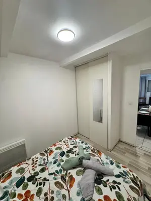 Un ou plusieurs lits dans un hébergement de l'établissement Appartement à 10 minutes du centre-ville