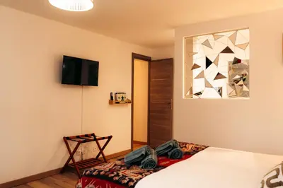 Un ou plusieurs lits dans un hébergement de l'établissement Maison Le Catelier