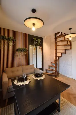 Coin salon dans l'établissement Le Cocon du Jardin duplex cosy, moderne et fibre