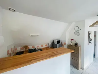 Cuisine ou kitchenette dans l'établissement Appartement lumineux garage privé centre-ville