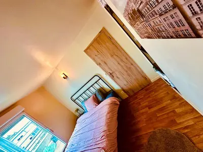 Un ou plusieurs lits dans un hébergement de l'établissement Alma Sweet Home