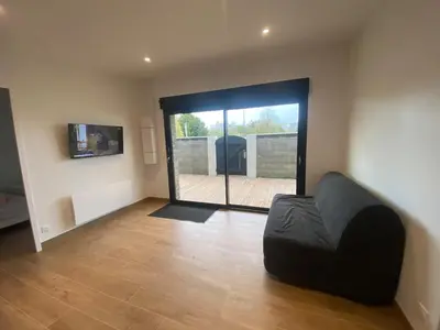 Télévision ou salle de divertissement dans l'établissement Les Cottages du Manoir Logement 1