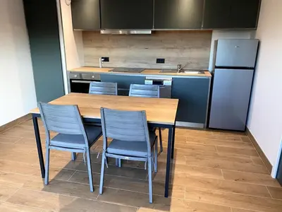 Cuisine ou kitchenette dans l'établissement Les cottages du Manoir Logement 2