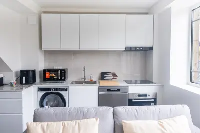 Cuisine ou kitchenette dans l'établissement Le Van G-Home