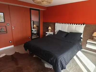Un ou plusieurs lits dans un hébergement de l'établissement Cocon sensuel - Jaccuzzi et petit déjeuner - Proche Chantilly et Beauvais