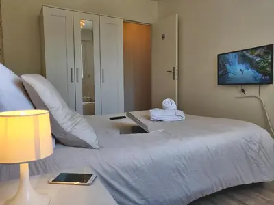 Un ou plusieurs lits dans un hébergement de l'établissement Appart'HomeCity - Rouen Grand Prieuré - 1 à 3 chambres