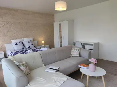 Coin salon dans l'établissement Appart'HomeCity - Rouen Grand Prieuré - 1 à 3 chambres