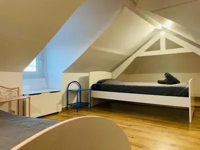 Un ou plusieurs lits dans un hébergement de l'établissement Havre de paix à Rouen duplex lumineux avec vue - 415