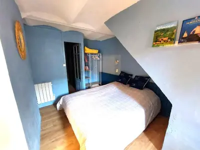 Un ou plusieurs lits dans un hébergement de l'établissement Appartement cosy dans le quartier du Vieux Tréport