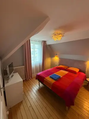 Un ou plusieurs lits dans un hébergement de l'établissement Charme et confort au cœur de Maisons-Laffitte