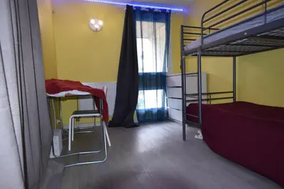 Un ou plusieurs lits dans un hébergement de l'établissement Vaste Appartement dupleix 3 chambre proche Stade de France